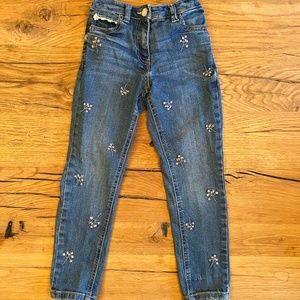 next. Size 7 years (girls). Pink floral embroidered skinny jeans.